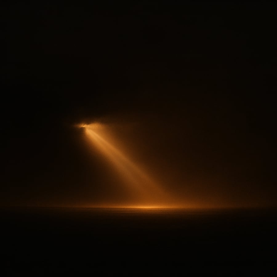 A single beam of warm light descending into darkness
